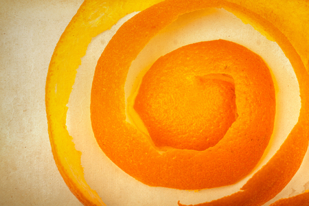 orange peel on the background of old paperの写真素材