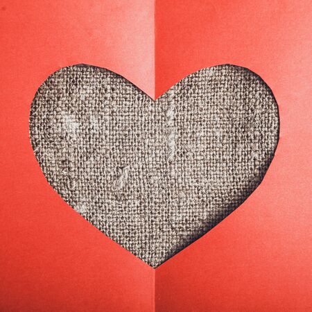 heart of red paper on canvasの写真素材
