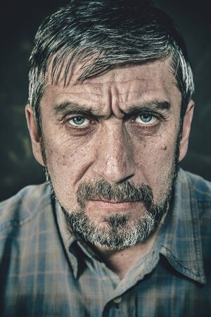 Portrait of a serious man with a beardの写真素材