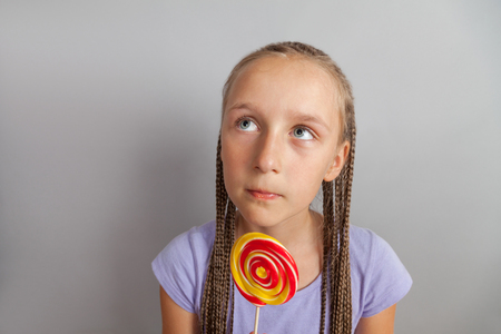happy girl woman with lollipopの写真素材