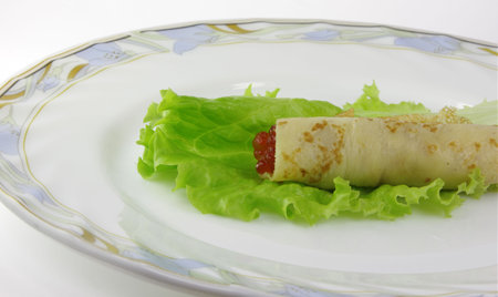 Close-up of pancake with caviar, izolated on whiteの写真素材