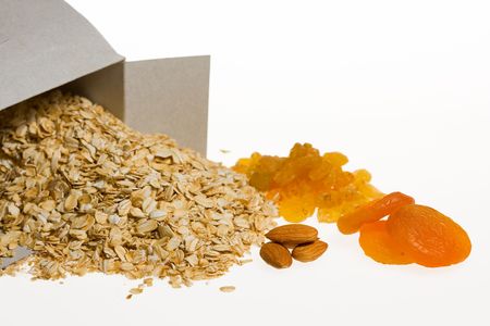 Close-up of cereals, almond, dried apricot and sultana isolated on whiteの写真素材