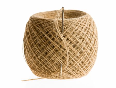 Closeup of needle and big clew isolated on whiteの写真素材
