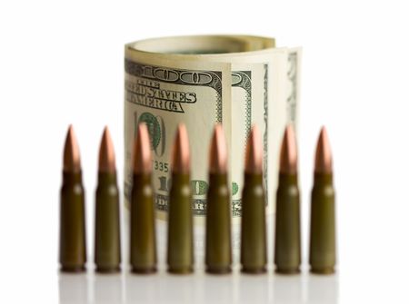 cartridges row infront of dollars roll as finance safety conceptの写真素材