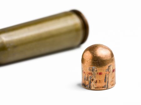 Macro shot of gun bullet and cartridge isolated on whiteの写真素材