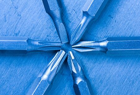 Macro of screwdriver replaceable bits over steel background, blue tonedの写真素材