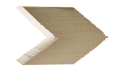 Close-up of arrow sign formed by cards shifted stackの写真素材