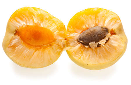 Close-up shot of fresh apricot sliced on two partsの写真素材