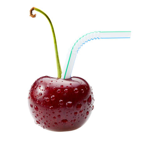 Macro of sweet cherry and straw over white backgroundの写真素材