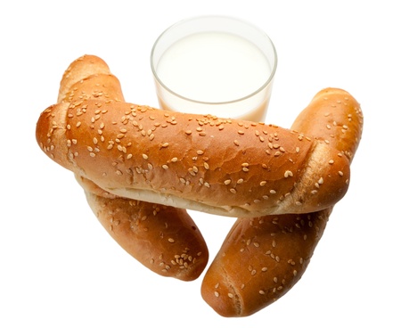 Composition of bagels and glass of milk isolated on whiteの写真素材