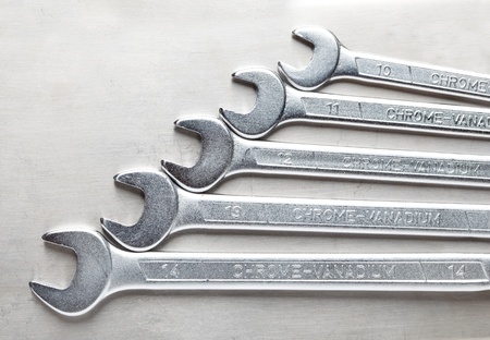 Macro of wrenches tool kit over steel backgroundの写真素材