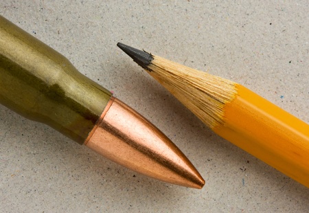 Cartridge and lead pencil - power vs. mind conceptの写真素材