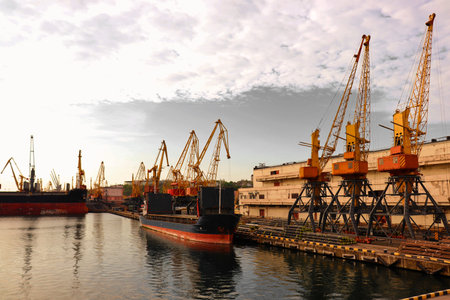 Marine terminal with a lot of crane. Ships for transporting cargo across the sea.