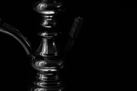 Hookah shaft close-up on a black background. Black and white photo.の写真素材