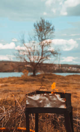 Summer outdoor recreation near the river with barbecue.の写真素材