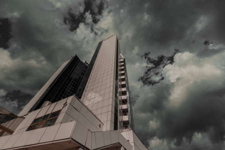 Odessa, Ukraine. September 18, 2021 - tall multi-storey hotel in Odessa near the sea on a cloudy day. High quality photoのeditorial素材