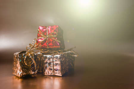 Christmas gold background with gifts in gold packaging. High quality photoの写真素材
