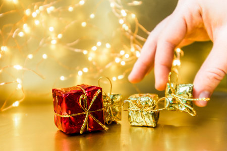 Christmas gold background with gifts. New Year presents. High quality photoの写真素材