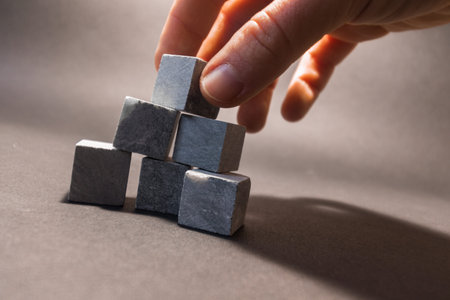 Whiskey stones stand on a gray background. Stones for cooling drinks. High quality photoの写真素材