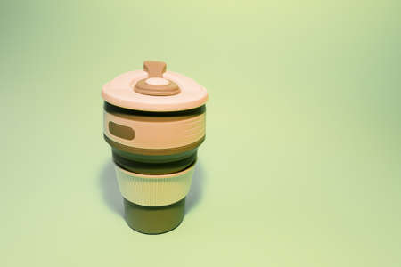 Reusable silicone cup for coffee on a light background. Replacement for disposable cups. high quality photoの写真素材