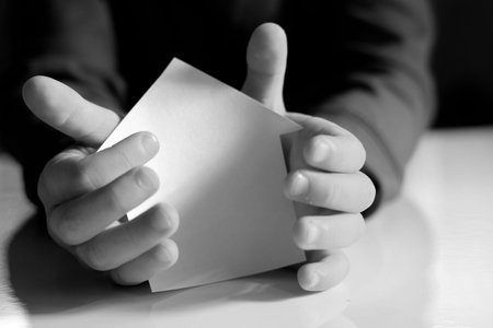 Paper house in handsの写真素材