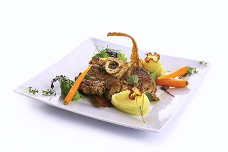 Beef osso bucco on port wine with peas and vegetable pureeの写真素材