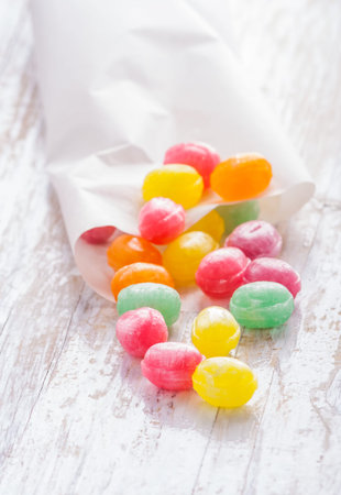 colors candies on white painted table.studio shot