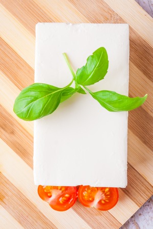 feta cheese on the kitchen board. studio shotの写真素材