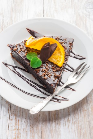 Dark Espresso Cake with Chocolate Glaze and orangeの写真素材