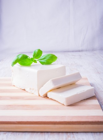 feta cheese on the kitchen board. studio shotの写真素材