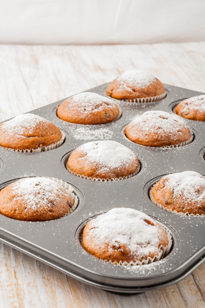 chocolate muffin on a  white wooden table. studio shotの写真素材
