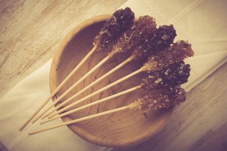 Crystal brown rock sugar candy on a stick. studio shotの写真素材