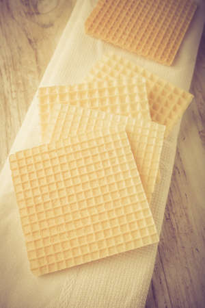 Dry wafers on white wooden table. studio shotの写真素材