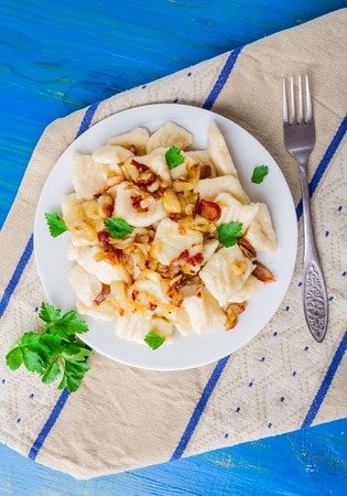 dumplings made of mashed potatoes on white plate. studio shotの写真素材