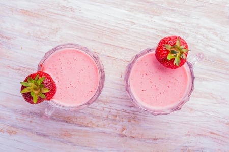 Strawberry cocktail  and fresh fruits on a white wooden table. studio shotの写真素材