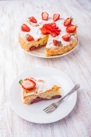 cake with strawberries on a white plate. studio shotの写真素材
