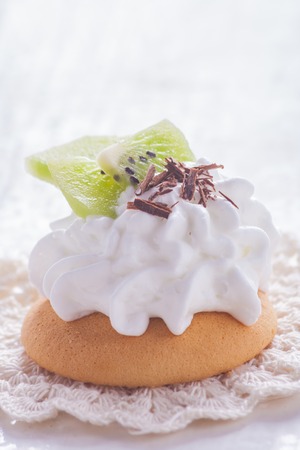 small biscuits with fruits and whipped cream. studio shotの写真素材