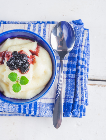 Tapioca pudding with blueberry jam in blue bowl. studio shotの写真素材