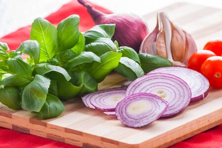 Ingredients for making pesto sauce on the kitchen tableの写真素材