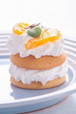 small biscuits with fruits and whipped cream. studio shotの写真素材
