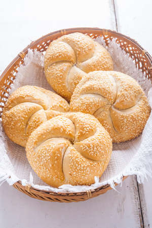 Fresh buns with sesame in basket. studio shotの写真素材