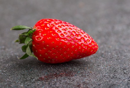 Fresh red trawberries on black background. studio shotの写真素材