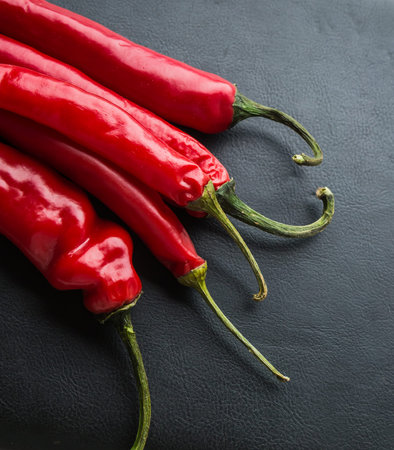 Red Hot Chili peppers on a black background. studio shot