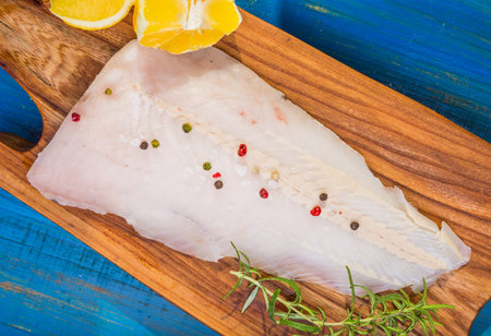 Raw fish fillets for frying on pan. kitchen composition.