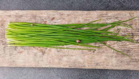 bunch of fresh chives on a table. studio shotの写真素材