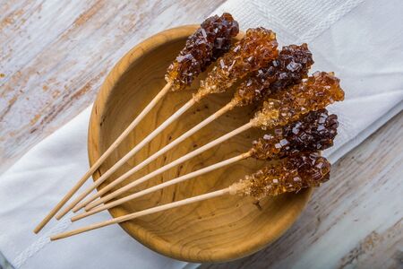 Crystal brown rock sugar candy on a stick. studio shotの写真素材