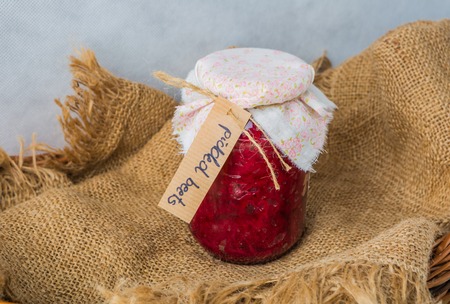 Canned beets in jar on the tablecloth. studio shotの写真素材