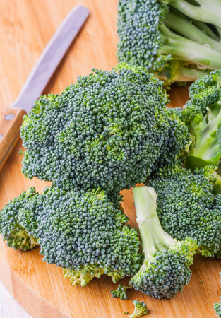 fresh green broccoli on wood tableの写真素材