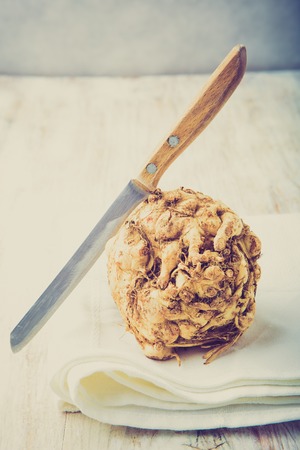 Vintage photo of celery root on a white tableの写真素材