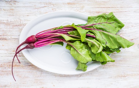 Young beets on a white plate. studio shotの写真素材